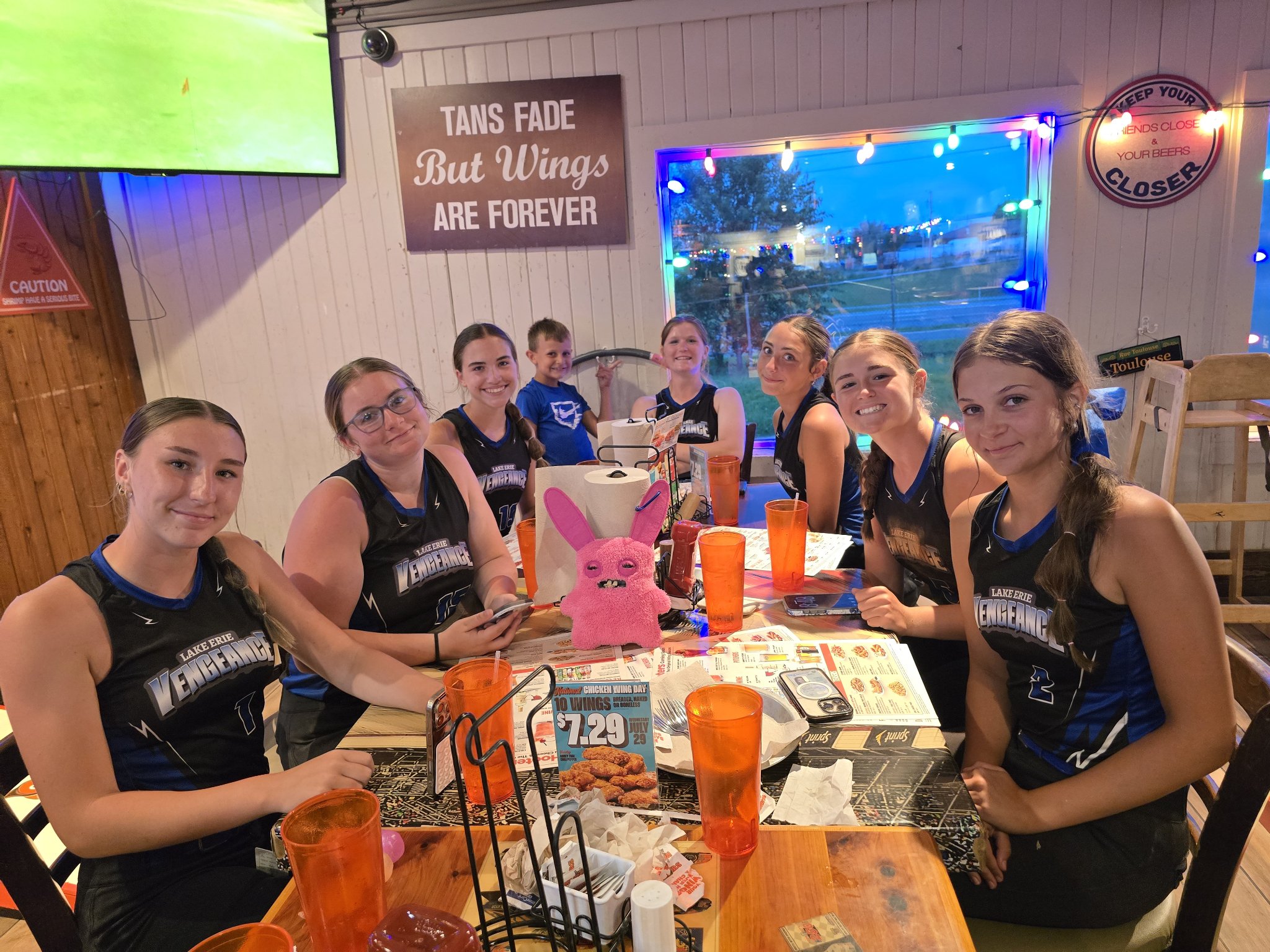 Lake Erie Vengeance players seated around a restaurant table for team dinner