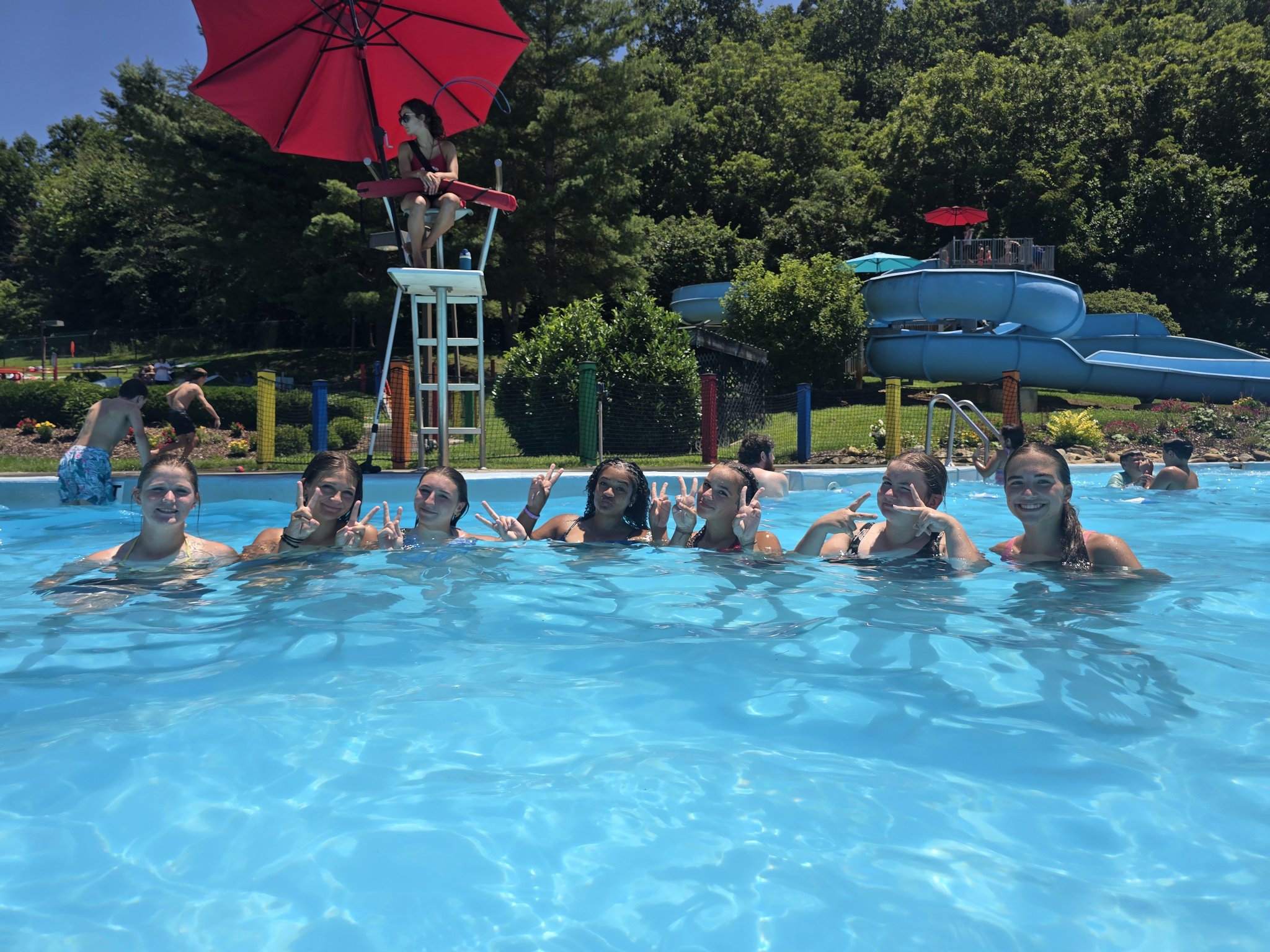 Lake Erie Vengeance players lined up together in a water park pool
